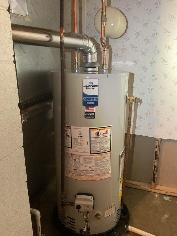 Installed new 40-gallon Bradford White water heater with all required code upgrades. Completed proper connection of copper water lines and ventilation system. Replaced unit in basement utility area, ensuring all components were correctly staged and installed according to manufacturer specifications.