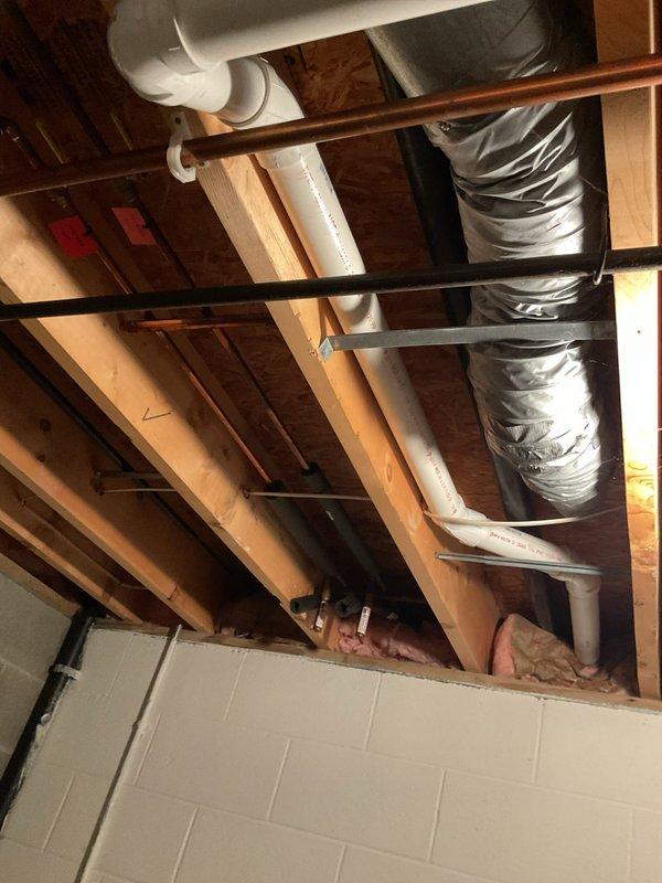 Successfully installed a new Bradford White 50-gallon power vent water heater with 6-year manufacturer warranty. Completed installation of thermal expansion tank and drain pan with pipe connected to floor drain. Replaced existing ABS exhaust with new PVC venting system routed to exterior.