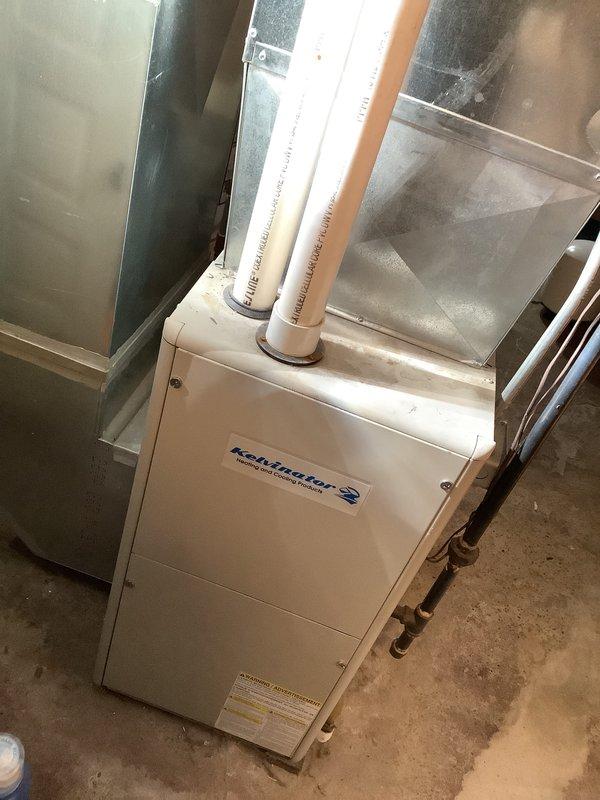 Completed inspection and provided estimate for replacement of an existing Kaltmeier furnace system. Observed current installation with dual PVC exhaust venting and connection to existing metal ductwork. Evaluated gas line connection with shut-off valve and insulated piping components. Photos documented current system configuration for accurate replacement proposal.