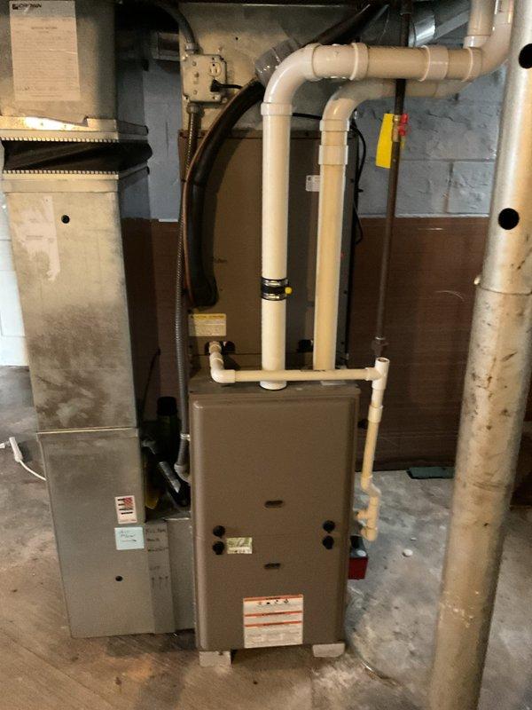 Responded to service call for 12-year-old furnace emitting asphalt and skunk-like odor. Customer reported concerns about fire hazard. Upon inspection of the blower motor and internal components, determined unit was unsafe to operate. Advised customer to keep system off until replacement can be performed. No heat currently available.