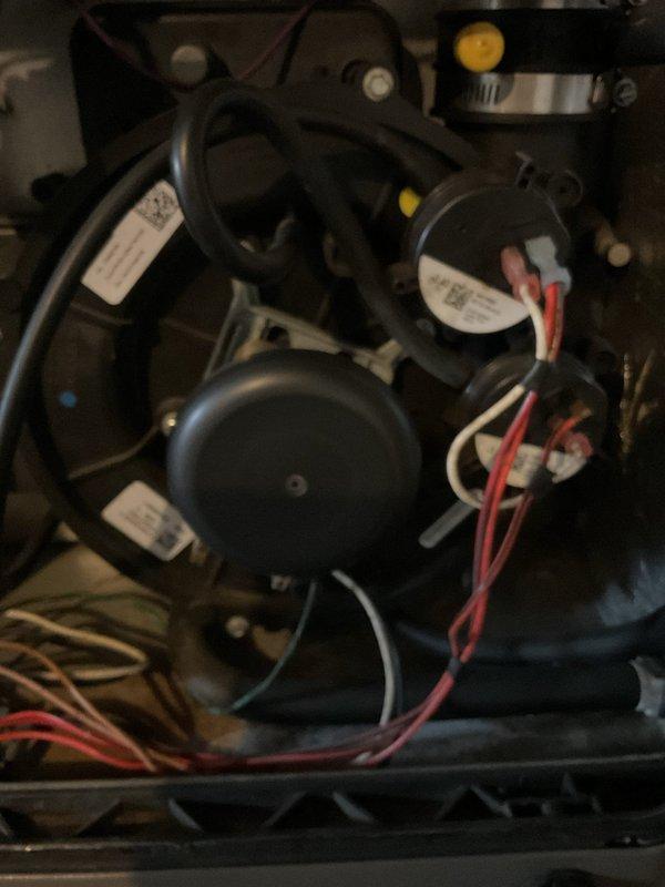 Responded to service call for 12-year-old furnace emitting asphalt and skunk-like odor. Customer reported concerns about fire hazard. Upon inspection of the blower motor and internal components, determined unit was unsafe to operate. Advised customer to keep system off until replacement can be performed. No heat currently available.