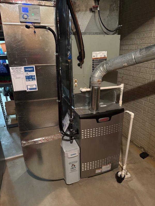 Successfully installed and configured two 80% efficiency furnaces with integrated humidification systems. Units were properly mounted with appropriate ventilation, including metal exhaust vent piping and PVC condensate drainage. All components were connected to existing ductwork with proper sealing and Aprilaire humidifiers were installed on both systems to maintain optimal indoor humidity levels.