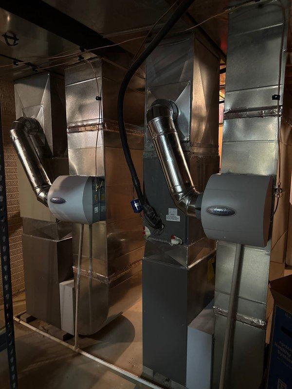 Successfully installed and configured two 80% efficiency furnaces with integrated humidification systems. Units were properly mounted with appropriate ventilation, including metal exhaust vent piping and PVC condensate drainage. All components were connected to existing ductwork with proper sealing and Aprilaire humidifiers were installed on both systems to maintain optimal indoor humidity levels.