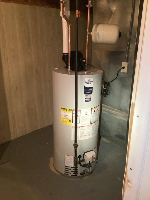 Successfully completed installation of 50-gallon power vent MVP water heater per customer's request. Installed new copper supply and return lines with appropriate fittings, and mounted expansion tank to wall. All connections were properly secured with metal clamps and the system was tested for proper operation.