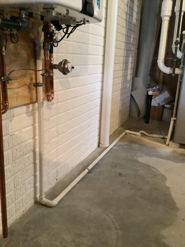 Successfully completed replacement of a 50-gallon power vent water heater with a new Navien tankless water heater. Installation included proper mounting of the unit to the utility room wall, connection of copper supply/return lines, and installation of PVC venting system. All connections were properly sealed and tested to ensure optimal performance and no leaks.
