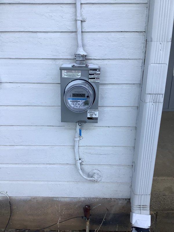 Responded to service call for outlet issues. Inspected exterior electrical meter for proper functionality and connection to main power supply. Removed faceplate from problematic interior outlet, accessed exposed wiring and dimmer control assembly, repaired damaged connections, and restored proper electrical function to the fixture.