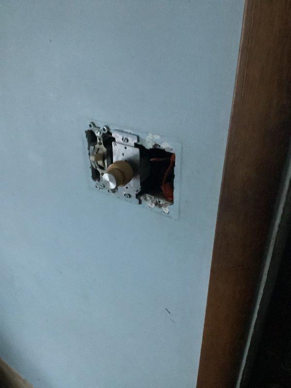 Responded to service call for outlet issues. Inspected exterior electrical meter for proper functionality and connection to main power supply. Removed faceplate from problematic interior outlet, accessed exposed wiring and dimmer control assembly, repaired damaged connections, and restored proper electrical function to the fixture.