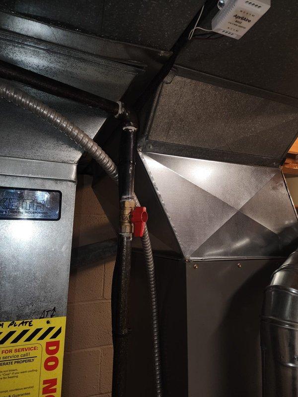 Completed installation of 80% efficiency furnace as second phase of HVAC system upgrade. Unit was properly mounted against basement wall with all required ductwork connections established. Installation included proper venting, condensate drainage via PVC piping, and connection of gas line with appropriate shut-off valve. All manufacturer safety labels were preserved and unit was tested for proper operation before completion.