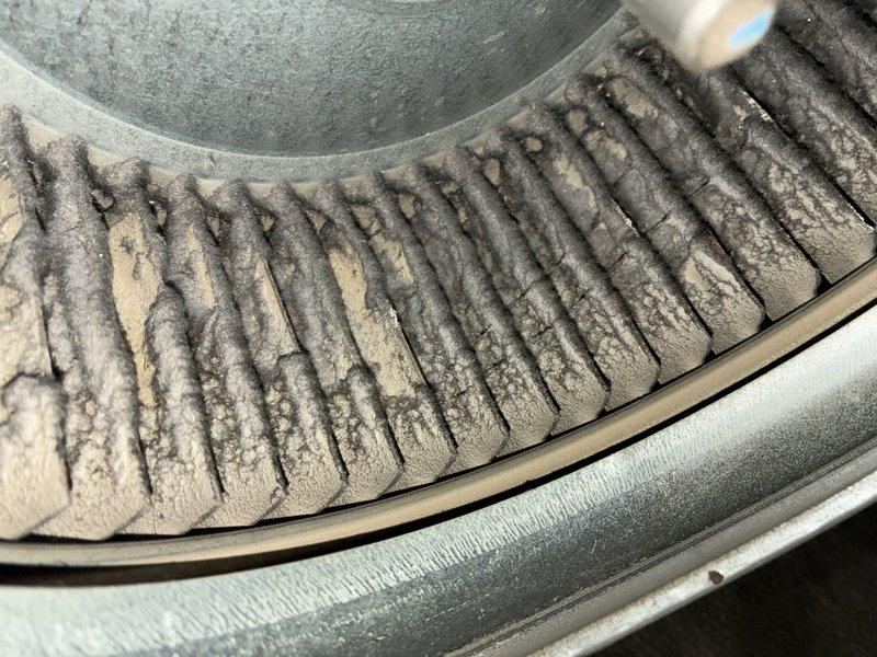 Responded to urgent no-heat call for 15-year-old furnace system. Diagnostic inspection revealed severely clogged cooling coils with extensive dust and debris accumulation, significantly reducing system efficiency. Performed thorough cleaning of heat exchanger components and verified proper operation of system after service, restoring heat functionality.