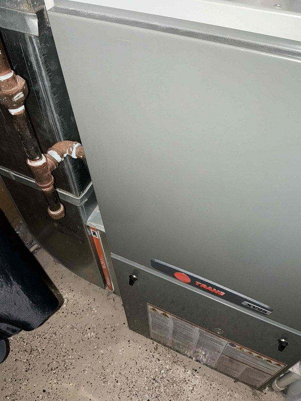Responded to emergency no-heat call for 15-year-old HVAC system. Diagnostic inspection revealed aging furnace with deteriorated components requiring full replacement. Installed new high-efficiency heating unit with updated PVC venting system and properly connected copper refrigerant lines to restore heating functionality.
