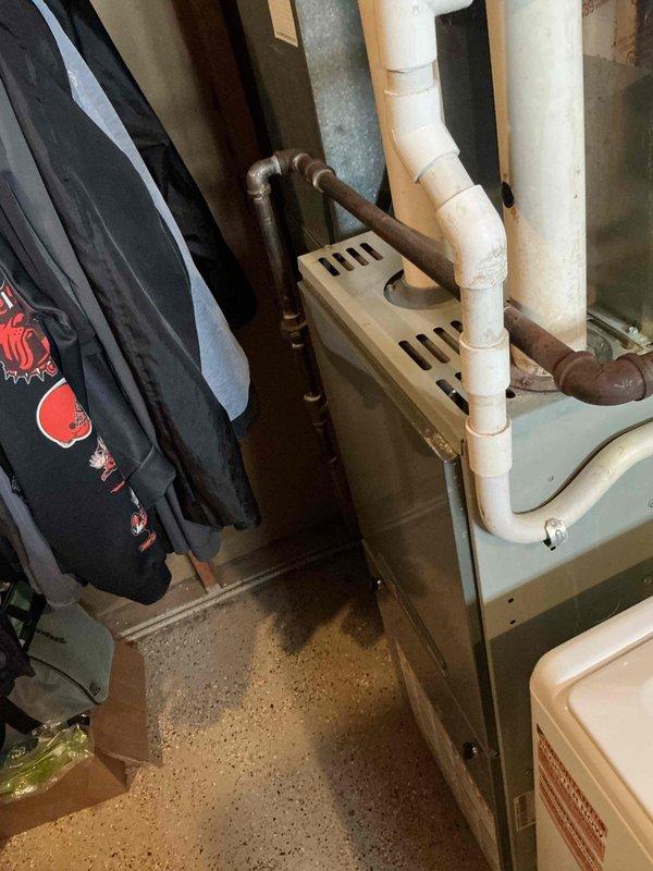 Responded to emergency no-heat call for 15-year-old HVAC system. Diagnostic inspection revealed aging furnace with deteriorated components requiring full replacement. Installed new high-efficiency heating unit with updated PVC venting system and properly connected copper refrigerant lines to restore heating functionality.