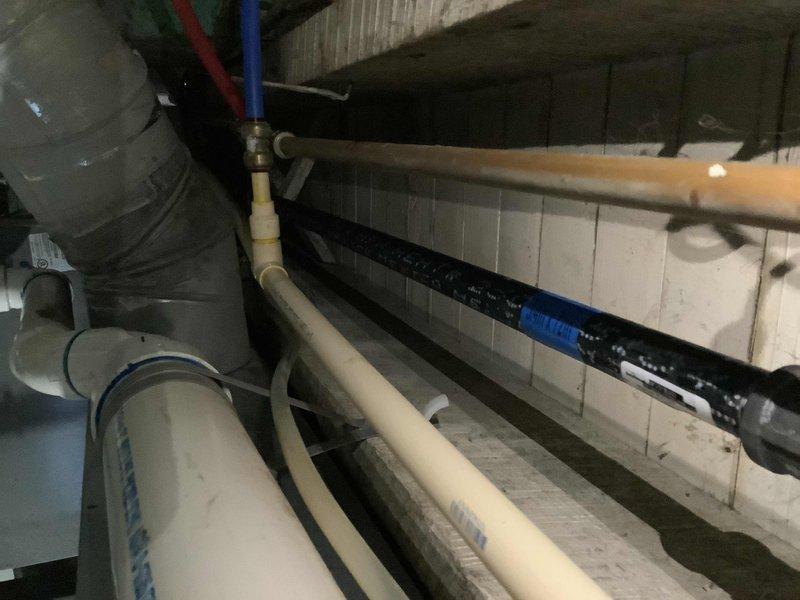 Responded to customer report of gas leak in 123-year-old residential property. Performed comprehensive pressure testing of gas lines in utility area. Inspected water heater installation and associated gas connections, identifying and repairing leak at brass fitting junction. Verified system integrity with follow-up pressure test confirming successful remediation.