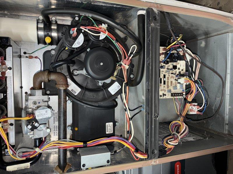 Responded to no heat call for 20-year-old furnace that was restarting but operating at reduced capacity with constant beeping. Diagnostic inspection revealed failing blower motor with deteriorated wiring connections and a compromised control board showing signs of electrical component failure. Replaced blower motor assembly and control board to restore proper system functionality and eliminate alarm condition.
