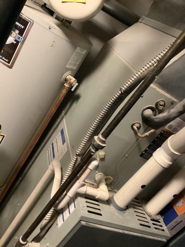 Performed inspection of 13-year-old furnace system and identified cracked heat exchanger requiring full replacement. Documented existing installation configuration including ventilation, water heater proximity, and current ducting layout. Prepared comprehensive replacement estimate for customer review.