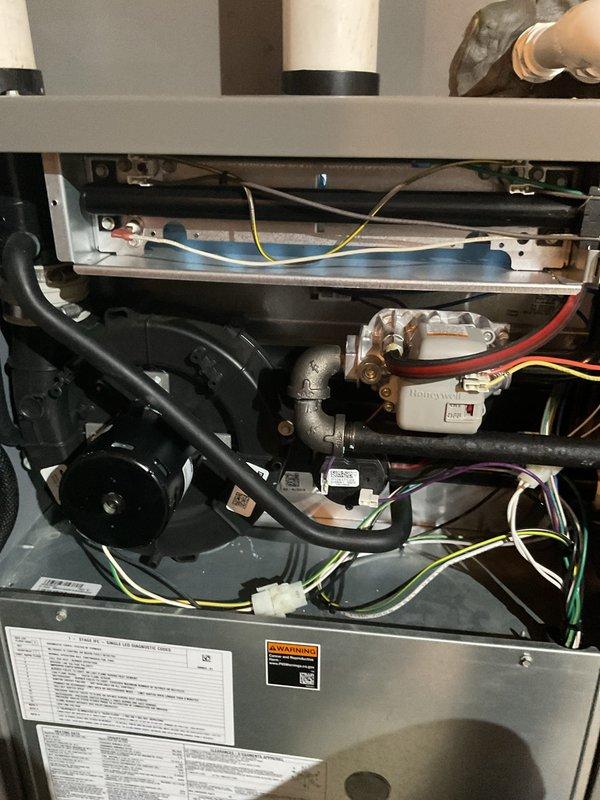 Responded to emergency service call for 4-year-old furnace overheating and triggering smoke alarms during extreme cold weather. Upon inspection, confirmed customer's report of a hole in the heat exchanger, which was previously identified by another technician. Performed comprehensive diagnostic of internal components including motor assembly, ventilation system, and electrical connections to verify the extent of damage.