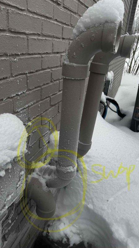 Responded to no-heat call for one-year-old furnace exhibiting short-cycling behavior. Inspection revealed extensive ice/frost buildup in exterior exhaust vent pipe, completely obstructing proper venting. Cleared ice blockage to restore proper exhaust flow, allowing furnace to operate normally with appropriate combustion ventilation.