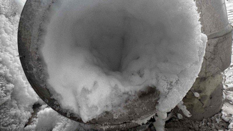 Responded to no-heat call for one-year-old furnace exhibiting short-cycling behavior. Inspection revealed extensive ice/frost buildup in exterior exhaust vent pipe, completely obstructing proper venting. Cleared ice blockage to restore proper exhaust flow, allowing furnace to operate normally with appropriate combustion ventilation.