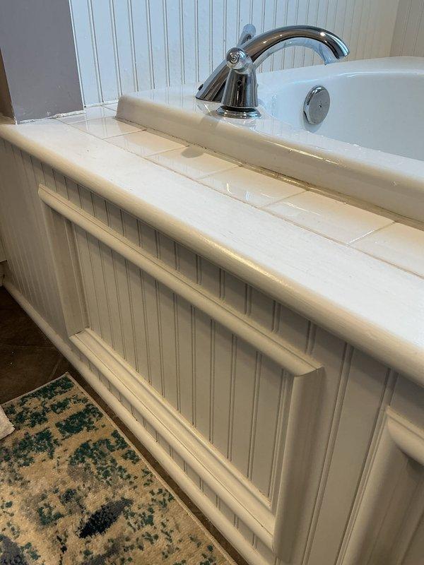 Responded to no hot water issue in bathroom. Inspected recently installed PCB tankless water heater system. Confirmed RH drive was clear and operational. Verified proper connection of copper supply lines and PVC venting. System now functioning correctly with adequate hot water delivery to bathroom fixtures.