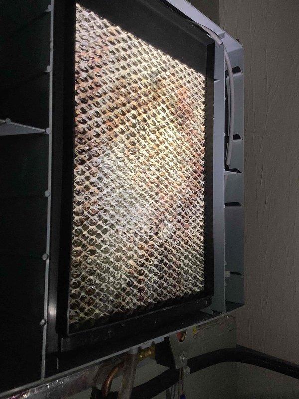 Performed comprehensive cooling system maintenance service as part of customer's maintenance plan. Inspected furnace blower motor assembly and electrical components, finding all connections secure and operational. Examined evaporator coil, noting accumulated dust and debris on mesh screen which was cleaned to improve system efficiency and airflow.