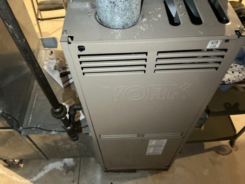 Conducted comprehensive evaluation of 32-year-old York furnace system. Unit is currently operational but showing significant age-related wear, including ductwork deterioration and potential corrosion on metal surfaces. Recommended complete system replacement due to equipment age exceeding standard service life.