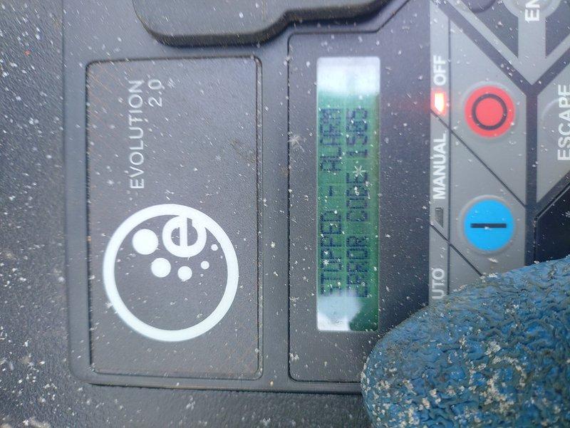 Responded to service call for a Generac Evolution 2.0 generator that failed to start with red indicator light illuminated. Inspected unit which was covered in significant snow accumulation. Cleared snow from generator housing and ventilation slots, tested control panel functionality, and reset system. Generator now operating normally with no fault codes present.