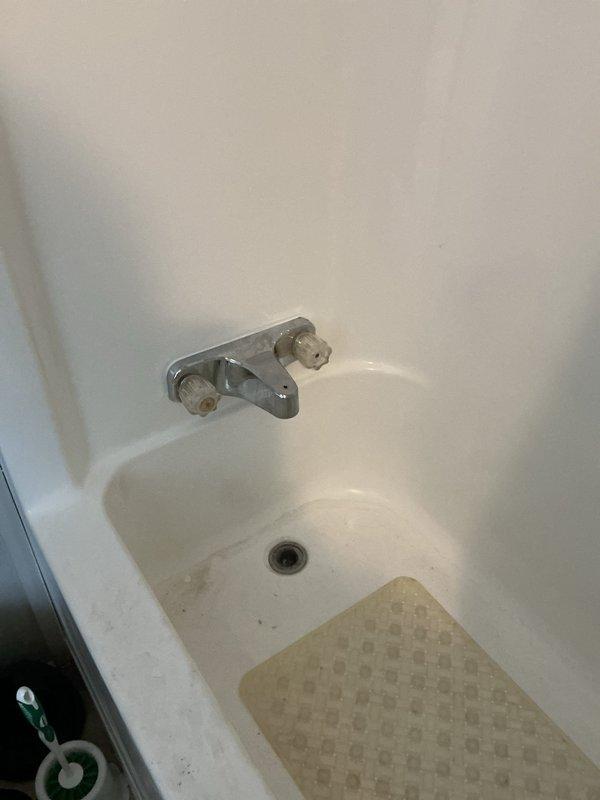 Responded to a low water pressure complaint in bathroom. Diagnosed issue with the tub diverter which had detached from fixture. Accessed wall cavity to inspect plumbing connections, which revealed signs of mineral buildup in pipes. Reattached diverter mechanism and performed pressure test to verify proper water flow restoration.