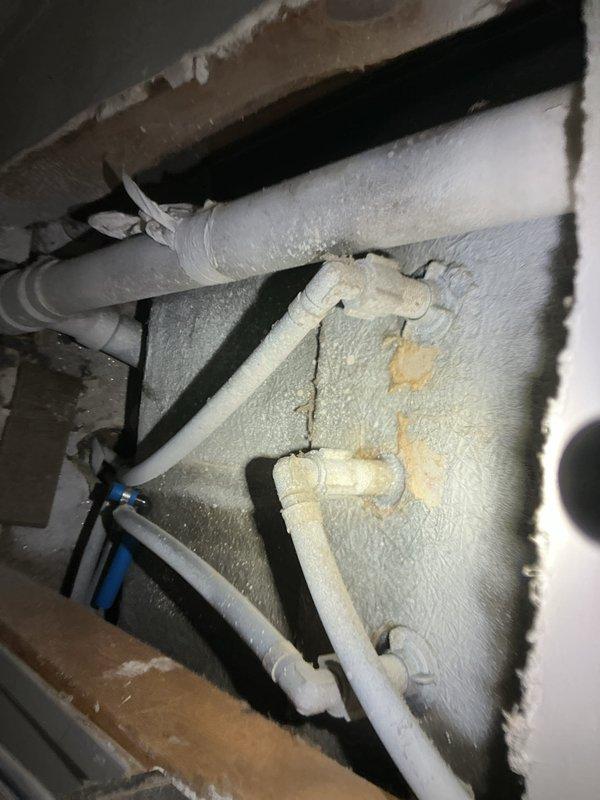 Responded to a low water pressure complaint in bathroom. Diagnosed issue with the tub diverter which had detached from fixture. Accessed wall cavity to inspect plumbing connections, which revealed signs of mineral buildup in pipes. Reattached diverter mechanism and performed pressure test to verify proper water flow restoration.