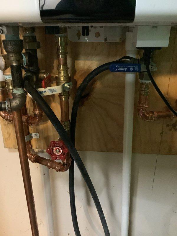 Performed scheduled maintenance service on 3-year-old Navien tankless water heater. Completed deliming and descaling procedure to remove mineral buildup and improve system efficiency. Unit is now operating properly with all connections secure and no leaks observed.