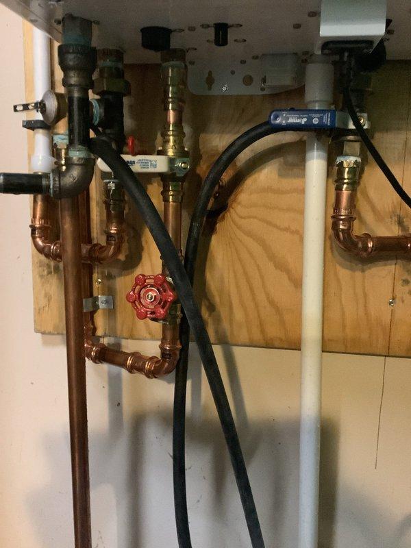 Performed scheduled maintenance service on 3-year-old Navien tankless water heater. Completed deliming and descaling procedure to remove mineral buildup and improve system efficiency. Unit is now operating properly with all connections secure and no leaks observed.
