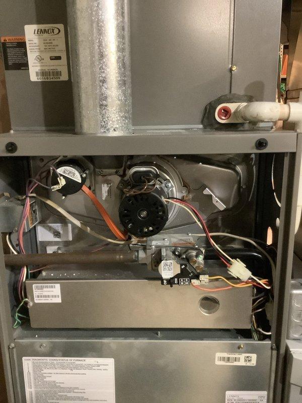 Performed scheduled maintenance on Lennox heating system. Inspected blower wheel assembly which showed signs of wear and scratching on the hub disc. Examined interior components including motor, fan assembly, electrical connections, and control boards to ensure proper functionality.