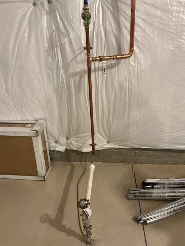 Conducted site assessment for secondary water meter installation. Customer requested information on Ruffins connection requirements for the second meter. Inspection revealed existing copper plumbing configuration with pressure regulation components and PVC drainage. No service performed as customer declined diagnostic fee and opted to continue researching options.