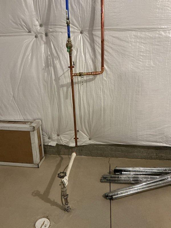 Conducted site assessment for secondary water meter installation. Customer requested information on Ruffins connection requirements for the second meter. Inspection revealed existing copper plumbing configuration with pressure regulation components and PVC drainage. No service performed as customer declined diagnostic fee and opted to continue researching options.