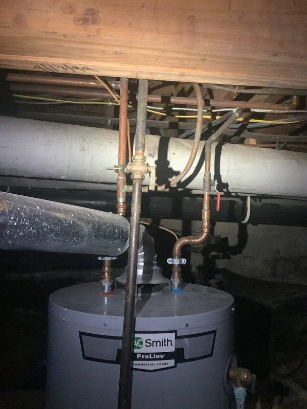 Responded to free estimate request for no hot water issue. Upon inspection, found an existing A.O. Smith ProLine commercial grade water heater installation with copper inlet/outlet piping. System includes properly installed gas line with appropriate yellow pipe and shutoff valve. Customer was initially inquiring about tankless options, but current setup appears to be a tank-style water heater system.