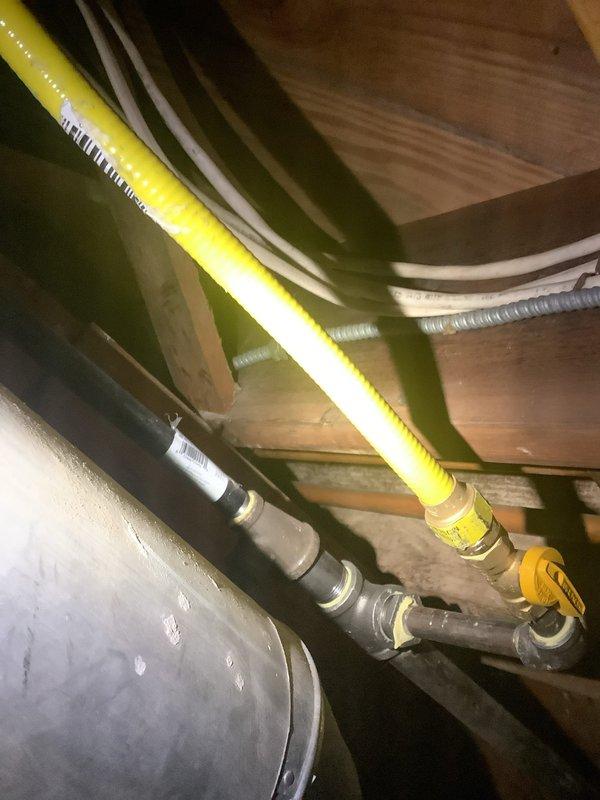 Responded to free estimate request for no hot water issue. Upon inspection, found an existing A.O. Smith ProLine commercial grade water heater installation with copper inlet/outlet piping. System includes properly installed gas line with appropriate yellow pipe and shutoff valve. Customer was initially inquiring about tankless options, but current setup appears to be a tank-style water heater system.