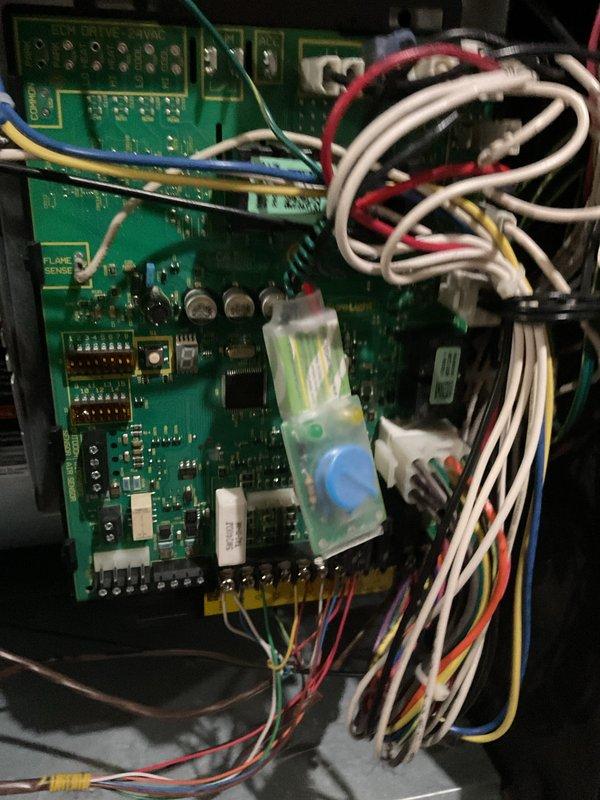 Performed scheduled heating maintenance for MVP customer. Conducted electrical diagnostic testing with digital multimeter showing 51.3 ohms reading. Inspected control board and flame sensor connections, verifying proper wiring arrangement and component functionality.
