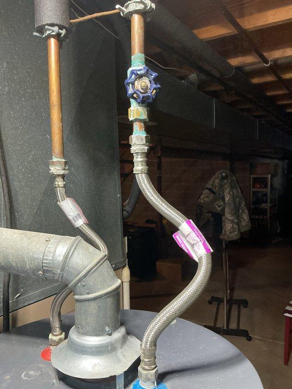 Responded to service call for tanked water heater with pilot light failure and popping noise during operation. Inspected copper supply lines, shut-off valve, and ventilation system. Cleaned thermocouple and burner assembly, adjusted gas pressure to manufacturer specifications, and verified proper operation after repair. Customer's ice maker issue was also examined but determined to require separate appliance service.