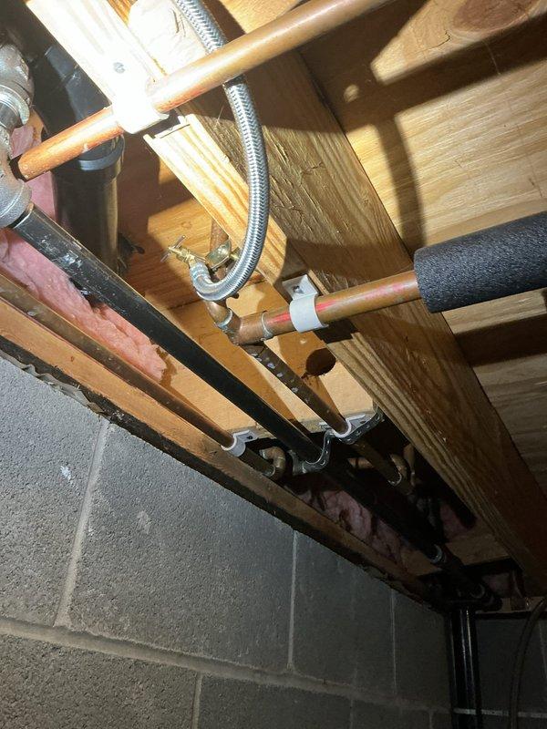 Responded to service call for tanked water heater with pilot light failure and popping noise during operation. Inspected copper supply lines, shut-off valve, and ventilation system. Cleaned thermocouple and burner assembly, adjusted gas pressure to manufacturer specifications, and verified proper operation after repair. Customer's ice maker issue was also examined but determined to require separate appliance service.