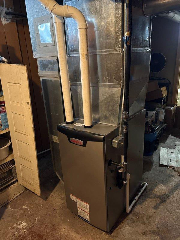 Completed installation of a Lennox 90% efficiency furnace as a second job on the property. Installed proper PVC exhaust venting system with dual pipes and connected to existing ductwork. Mounted and tested a Kidde carbon monoxide alarm to ensure safe operation of the new heating system.