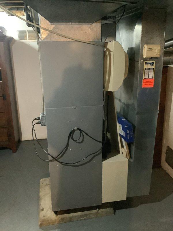 Successfully installed a new 80% efficient furnace in a residential basement setting. Unit was properly mounted on a concrete pad with all necessary ductwork connections completed. Installation included connecting the humidifier and ensuring all electrical components were properly wired according to manufacturer specifications.