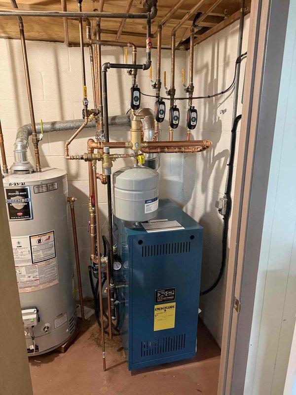 Completed comprehensive boiler replacement project, installing new blue heating unit with integrated digital control system and expansion tank. Successfully configured all necessary copper piping connections and installed new electrical control panel with digital interface to ensure optimal system performance and efficiency.