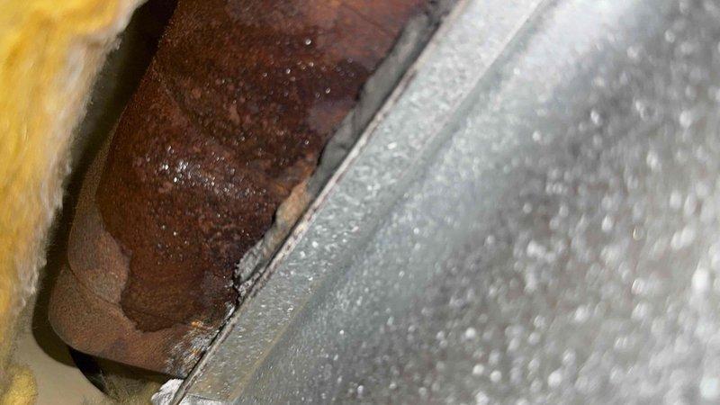 Responded to no heat complaint on 12-year-old boiler system affecting main floor. Inspection revealed extensive corrosion and moisture accumulation on boiler components. Identified rusted metal surfaces with condensation buildup, indicating potential leak or humidity issues compromising system function. Restored heating operation after addressing moisture-related failure points.