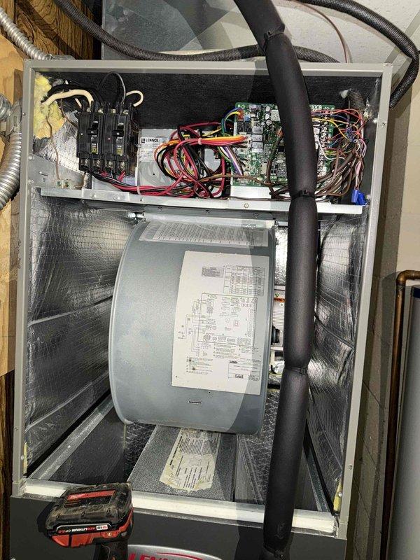 Performed routine maintenance on Mitsubishi mini-split system installed in wood-paneled room. Inspected electrical components including circuit board, wiring connections, and blower motor assembly. Confirmed proper operation of wall-mounted remote control and thermostat.