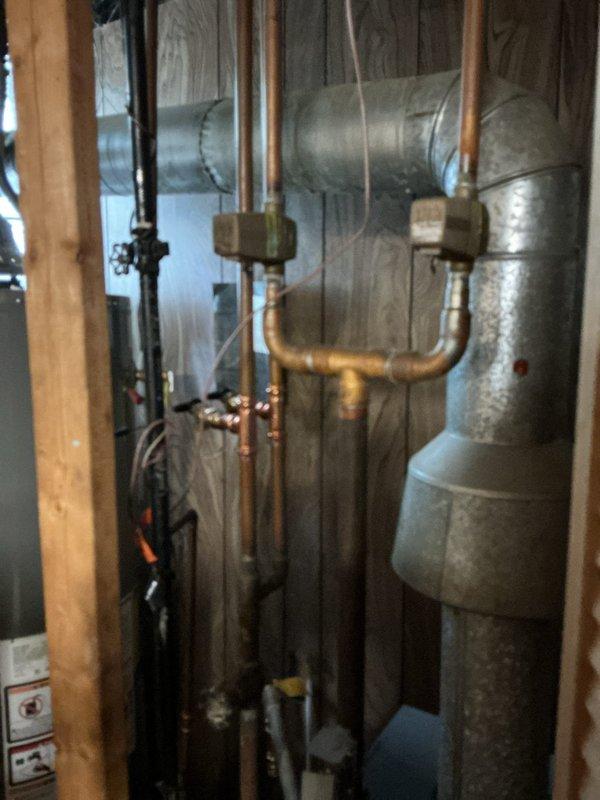 Inspected air vent and air separator components on customer's boiler system. Documented the current installation with photographs, showing copper piping configuration and metal ductwork in the utility area. Provided customer with quote for replacement parts as requested.