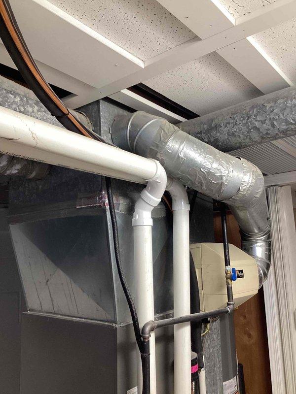 Completed MVP furnace maintenance service on customer's HVAC system. Inspected air handler/furnace unit and associated ductwork in utility area, confirming proper installation and connection integrity. All components were found to be in satisfactory working condition with no immediate issues requiring attention.