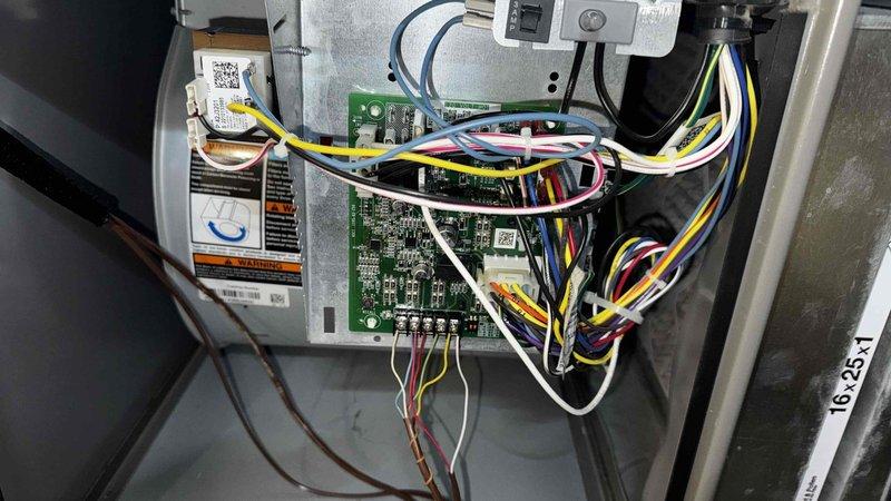 Performed routine furnace tune-up as scheduled. Inspected control board and electrical connections, confirming proper functionality of all circuits and wiring harnesses. Noted water heater showing signs of moisture damage on adjacent wall, which may require future attention but is not affecting furnace operation.