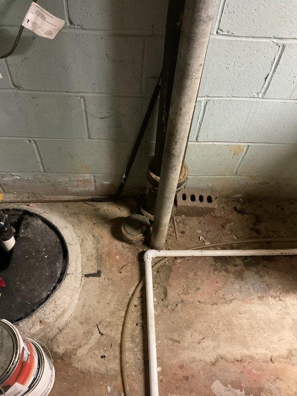 Responded to customer complaint of basement drain backup and kitchen sink gurgling when flushing toilet. Inspection revealed issue stemming from recent water line break on street affecting home's drainage system. Cleared main line blockage using drain snake and verified proper drain function throughout house, eliminating cross-connection issues between kitchen and bathroom waste lines.