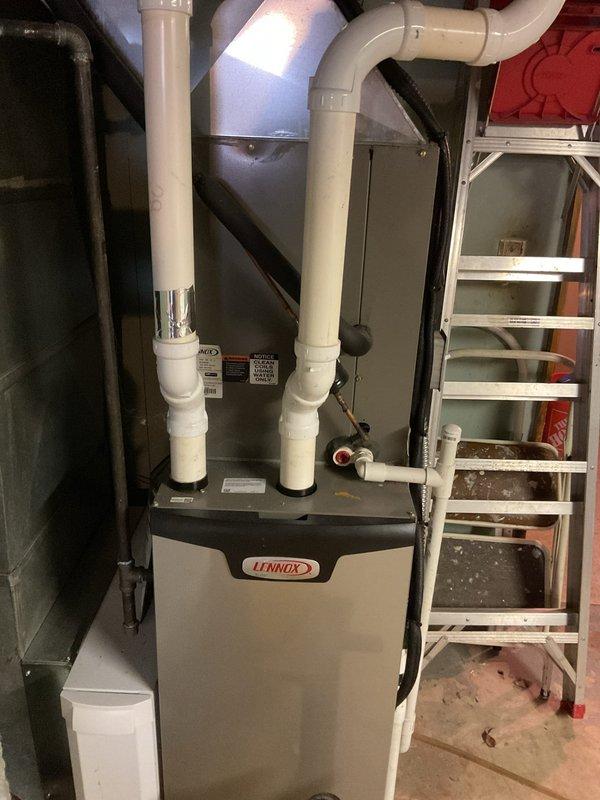 Responded to customer complaint of basement drain backup and kitchen sink gurgling when flushing toilet. Inspection revealed issue stemming from recent water line break on street affecting home's drainage system. Cleared main line blockage using drain snake and verified proper drain function throughout house, eliminating cross-connection issues between kitchen and bathroom waste lines.