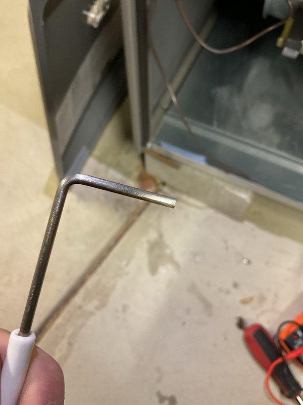 Performed scheduled MVP heating maintenance visit and connected customer's humidifier as previously requested by customer at installation. Conducted electrical measurements with digital multimeter to verify proper voltage readings (52.2V). Used hex key to access and service equipment components as part of comprehensive heating system inspection.