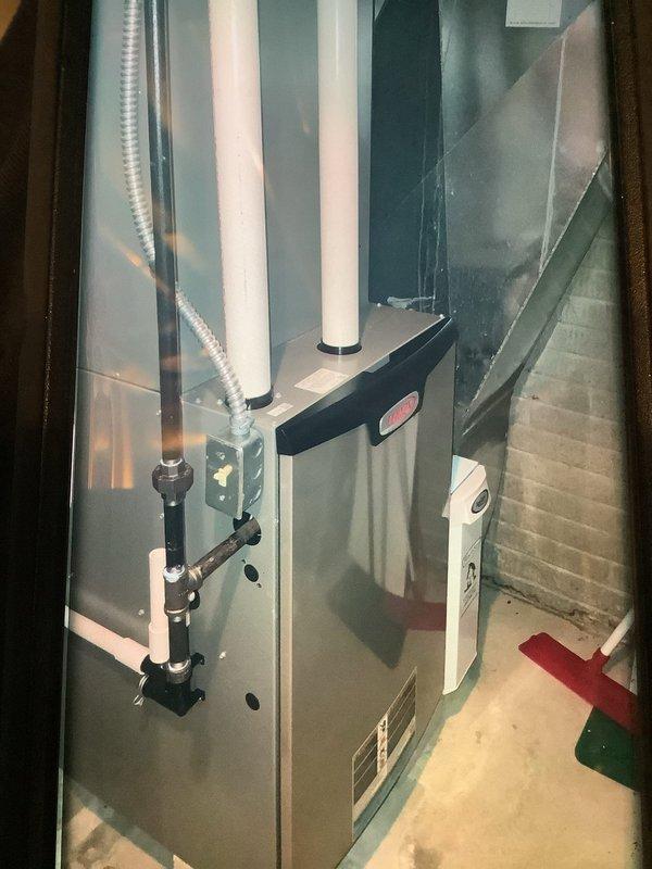 Performed scheduled MVP Heating maintenance service on furnace system of unknown age. Conducted full inspection of the unit, including examination of PVC ventilation pipes, condensate drainage system, and associated ductwork. All components were found to be functioning properly with no issues requiring immediate attention.