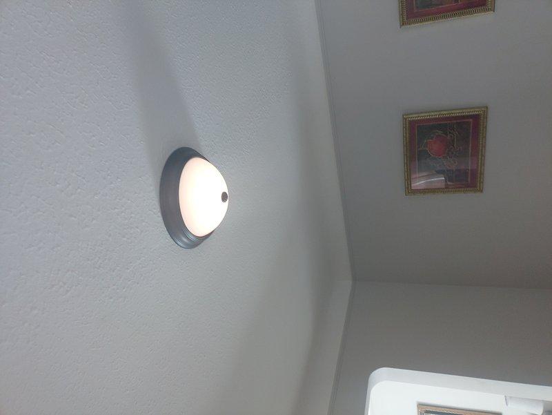 Completed installation of customer-supplied ceiling light fixture in dining room, replaced faulty light switch, and installed new doorbell system including chime and transformer. All components were properly mounted, wired according to code, and tested for functionality.